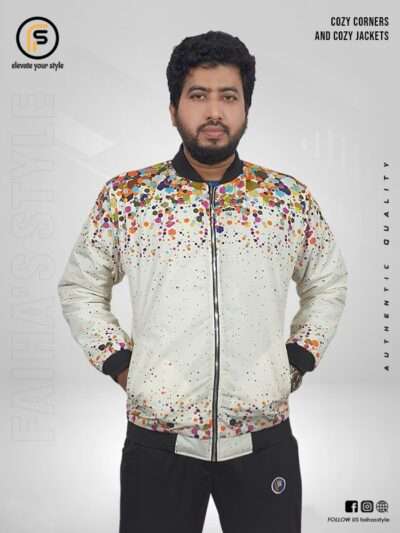 White zip-up jacket with colorful dot patterns, worn by a man standing in front of a light gray background with branding elements, including “Cozy Corners and Cozy Jackets” text on the right side