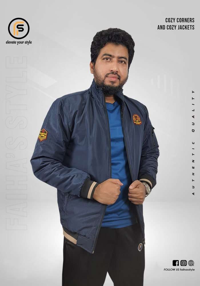 Man modeling a Navy Blue beige bomber jacket with a subtle logo on the upper left sleeve. The jacket has ribbed cuffs and hem, adding a snug fit to the classic design. Text overlays read 'Cozy Corners and Cozy Jackets' and 'Authentic Quality,' with 'Faiha's Style' branding in the background