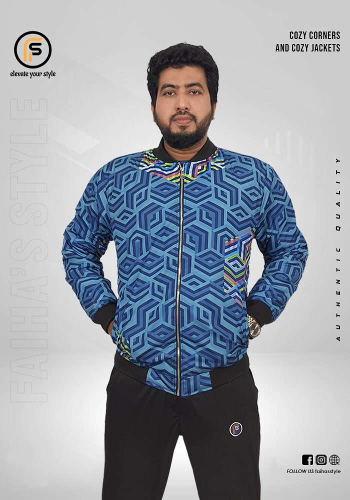 Man wearing a vibrant blue bomber jacket with a geometric pattern. The intricate blue and green cube design gives a modern, textured look. Branding texts 'Cozy Corners and Cozy Jackets' and 'Authentic Quality' are overlaid, with 'Faiha's Style' subtly incorporated in the background.