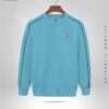 Front view of a Sky Blue sweatshirt with dark trim on a hanger, featuring a small circular logo on the chest. Text around reads "Elevate Your Style" and "Authentic Quality." Discover unmatched style at an unbeatable sweatshirt price in BD.