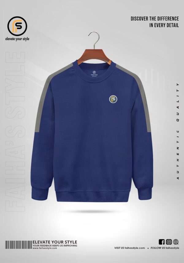 Petrol crewneck sweatshirt with grey contrasting sleeves, a small embroidered 'F' logo on the chest, and a ribbed hem and cuffs.