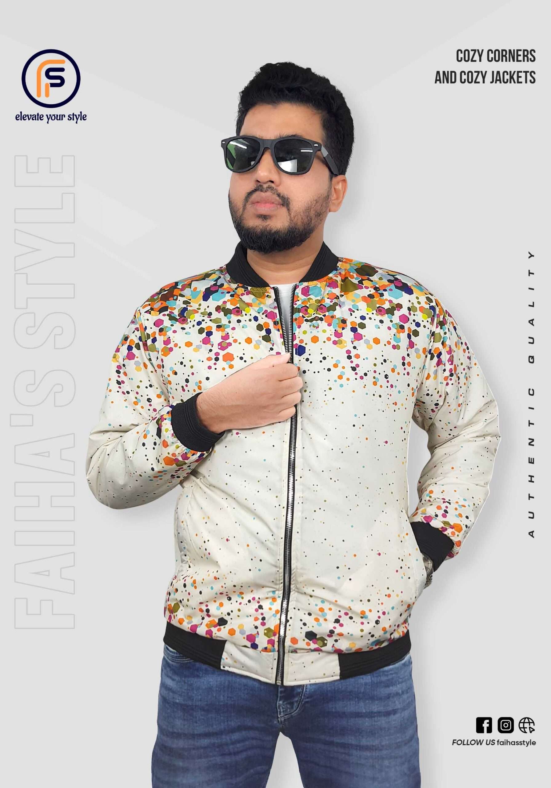 White zip-up jacket with colorful dot patterns, worn by a man standing in front of a light gray background with branding elements, including “Cozy Corners and Cozy Jackets” text on the right side